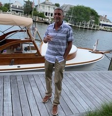 man standing near boat